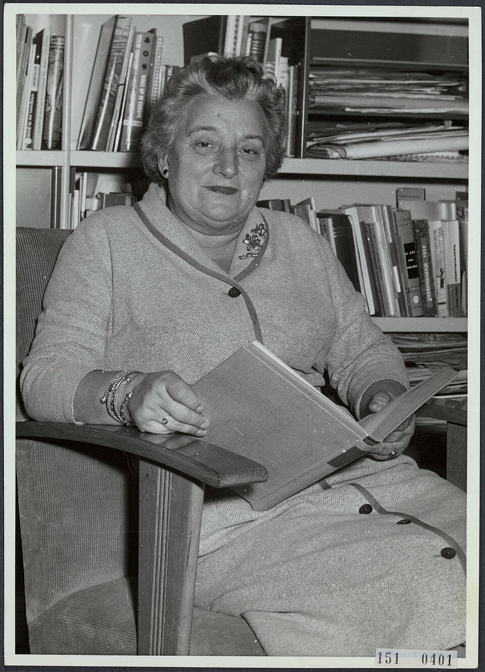 Geertruida Wijsmuller sitting in chair with open book