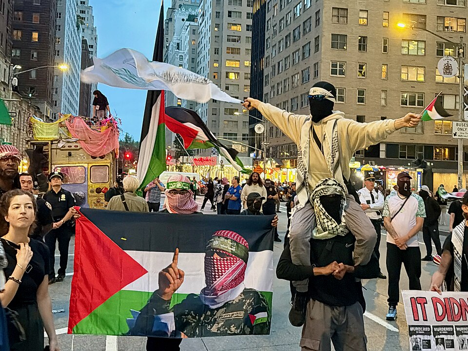 Protesters carrying Palestinian flags and Hamas-linked imagery march through New York City.