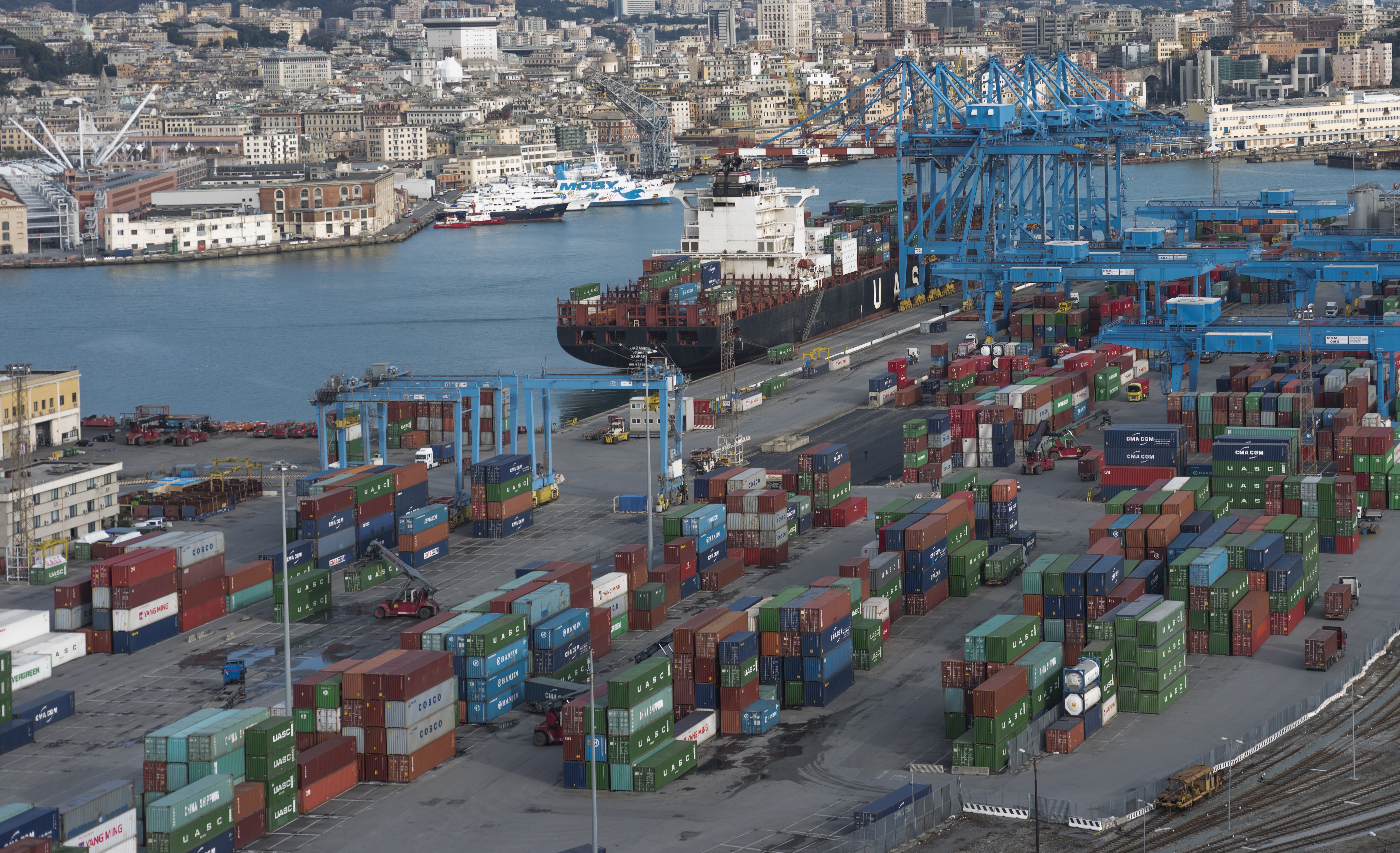 Container terminal and cargo ships at the Port of Genoa in Italy.