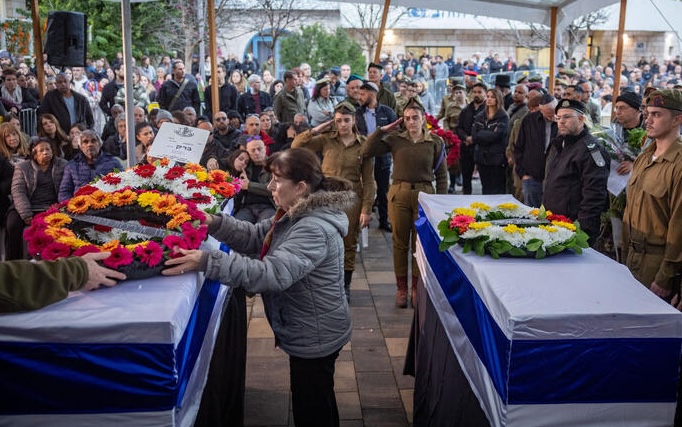 Family and friends attend the funeral of Barak Ayalon and his mother Mira Ayalon in northern Israel.