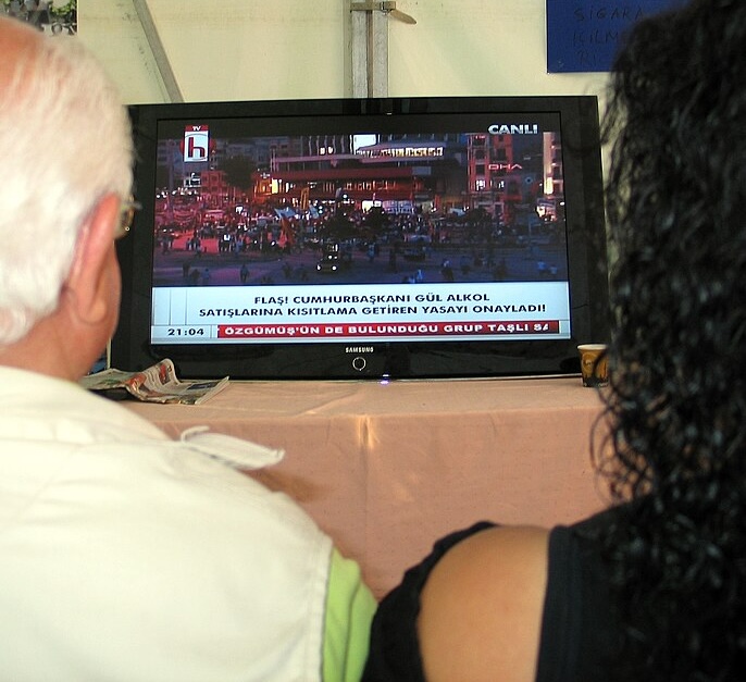Viewers watch a Halk TV broadcast covering protests in Turkey in 2013.
