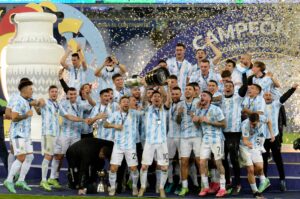 Argentina national team players celebrating with a trophy