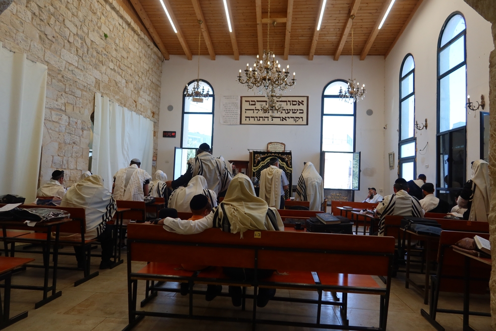 Jews praying in a Minyan at a synagogue in Safed, Israel