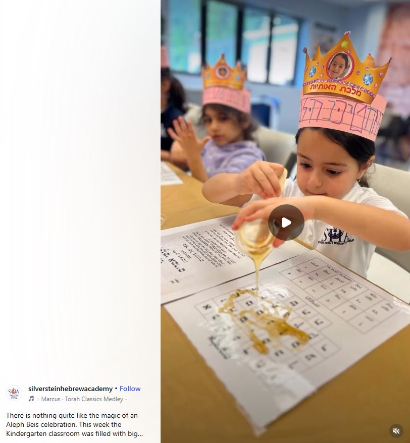 child pouring honey on aleph bet