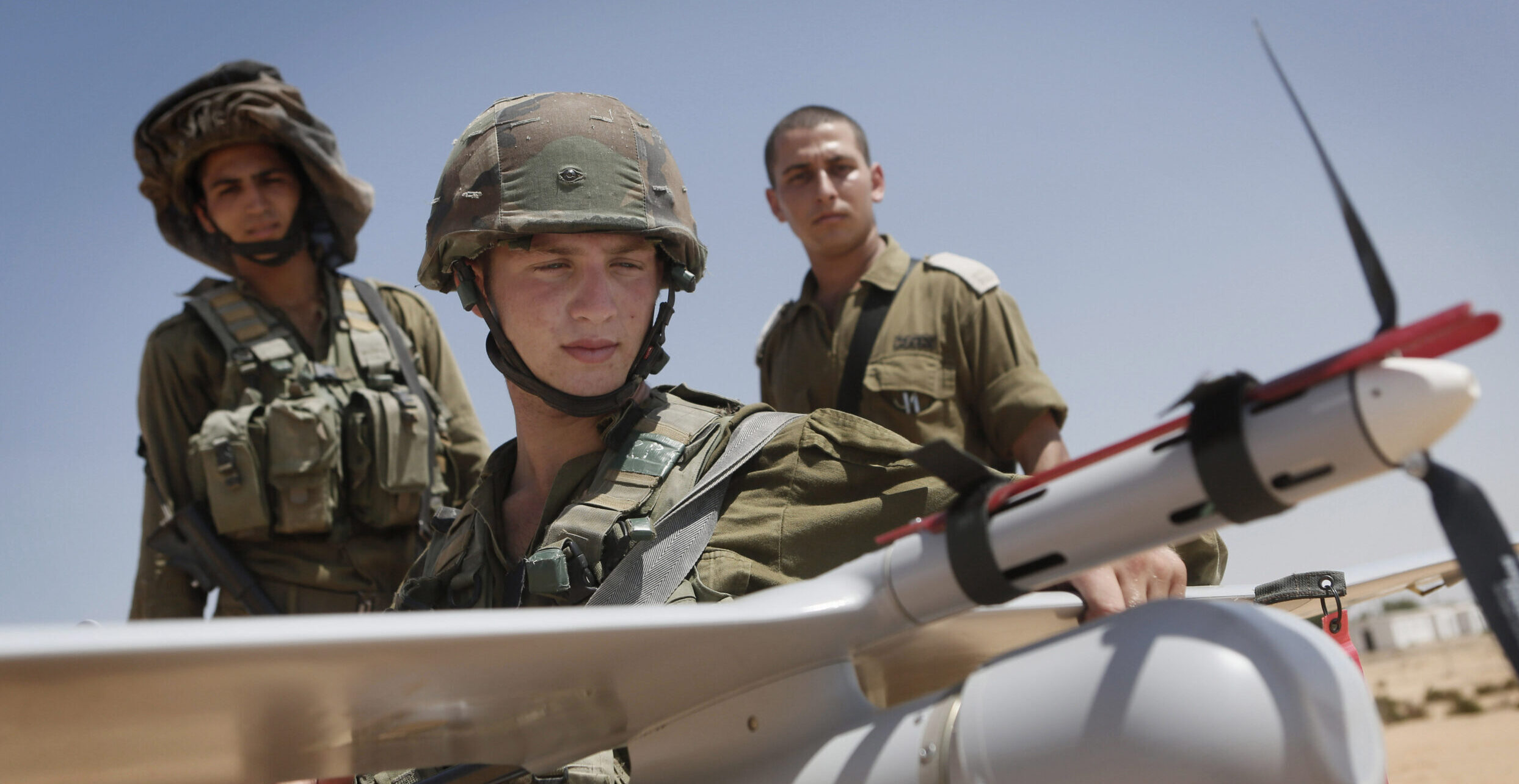 IDF Sky Rider Unit soldiers stand beside an unmanned aerial vehicle during a training drill.