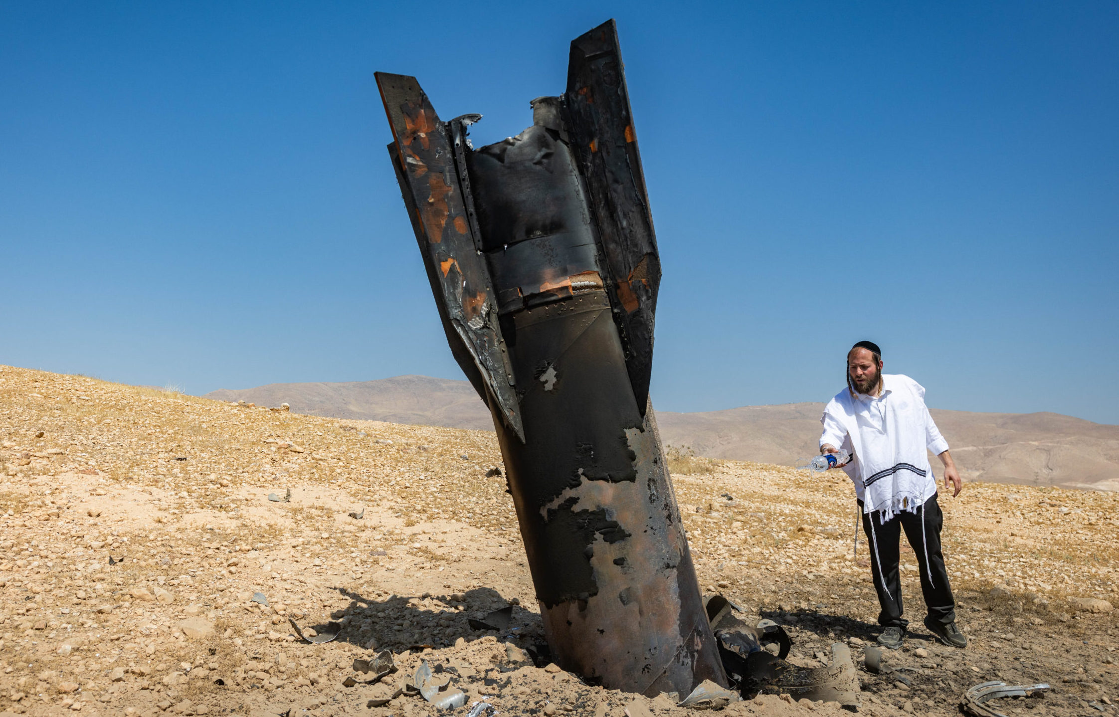 Part of an Iranian ballistic missile seen in the desert near Vered Jericho after being fired toward Israel from Iran.