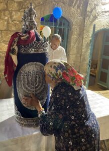 A Torah scroll being brought into the ancient synagogue in Peki'in.