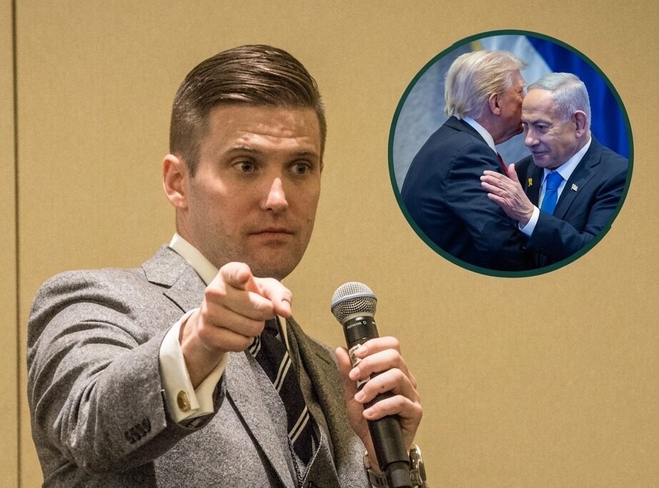 Nick Fuentes speaks into a microphone during an event.