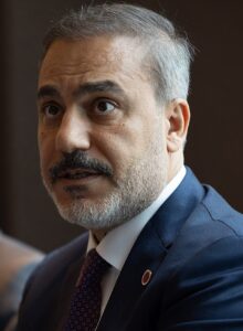 Turkish Foreign Minister Hakan Fidan speaking during a meeting.