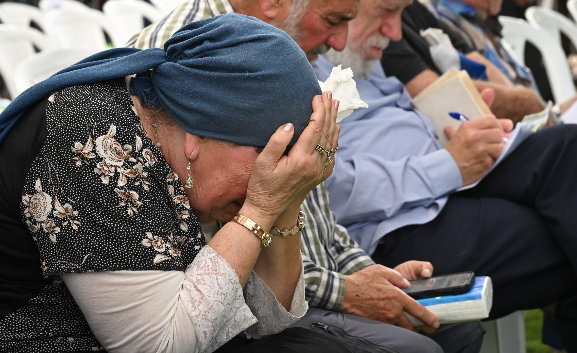Family and friends mourning at the funeral of Capt. Shahar Gamla in northern Israel.