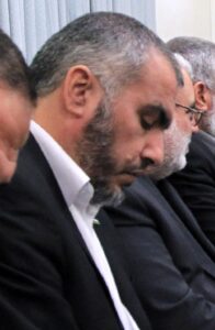 Ghazi Hamad sits during a meeting with Hamas officials and Iranian Supreme Leader Ali Khamenei.