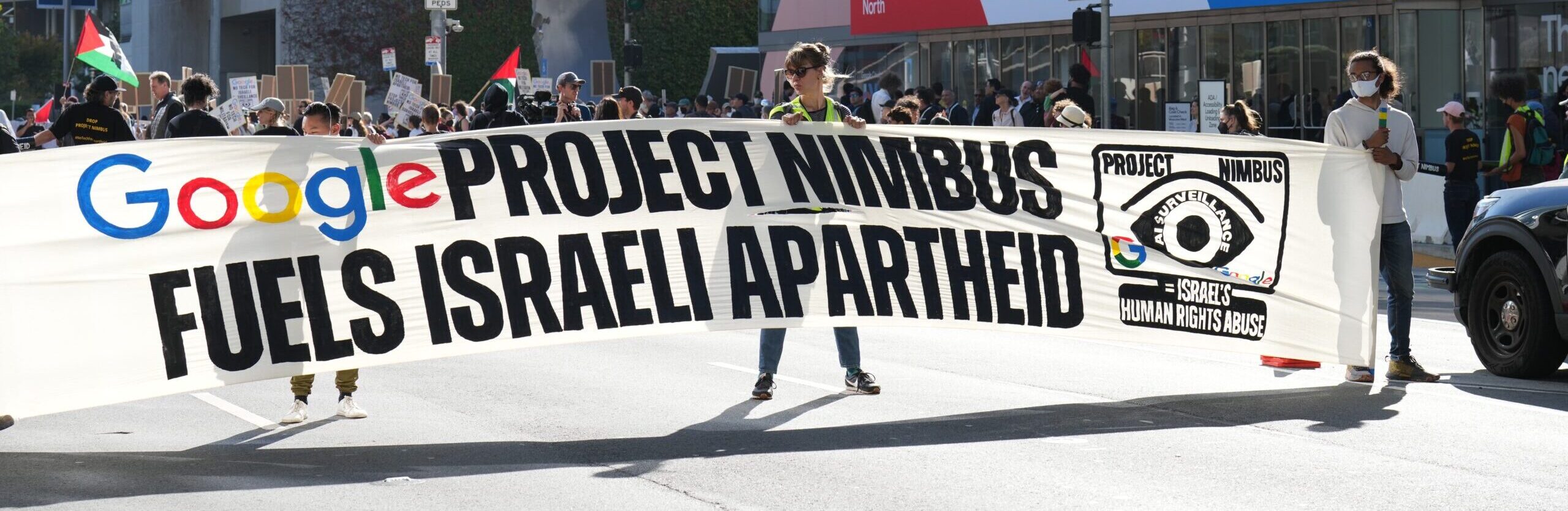Protesters hold a banner against Google’s Project Nimbus outside the Moscone Center.