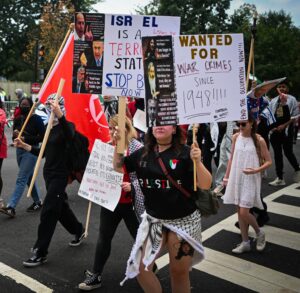 Pro-Palestinian protesters holding signs outside the U.S. Congress in Washington.