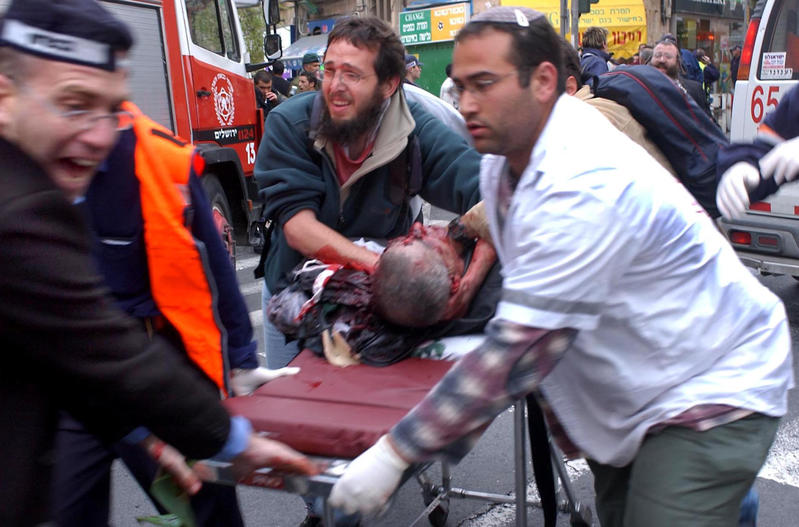medics with man on gurney, sbarro bombing 2001