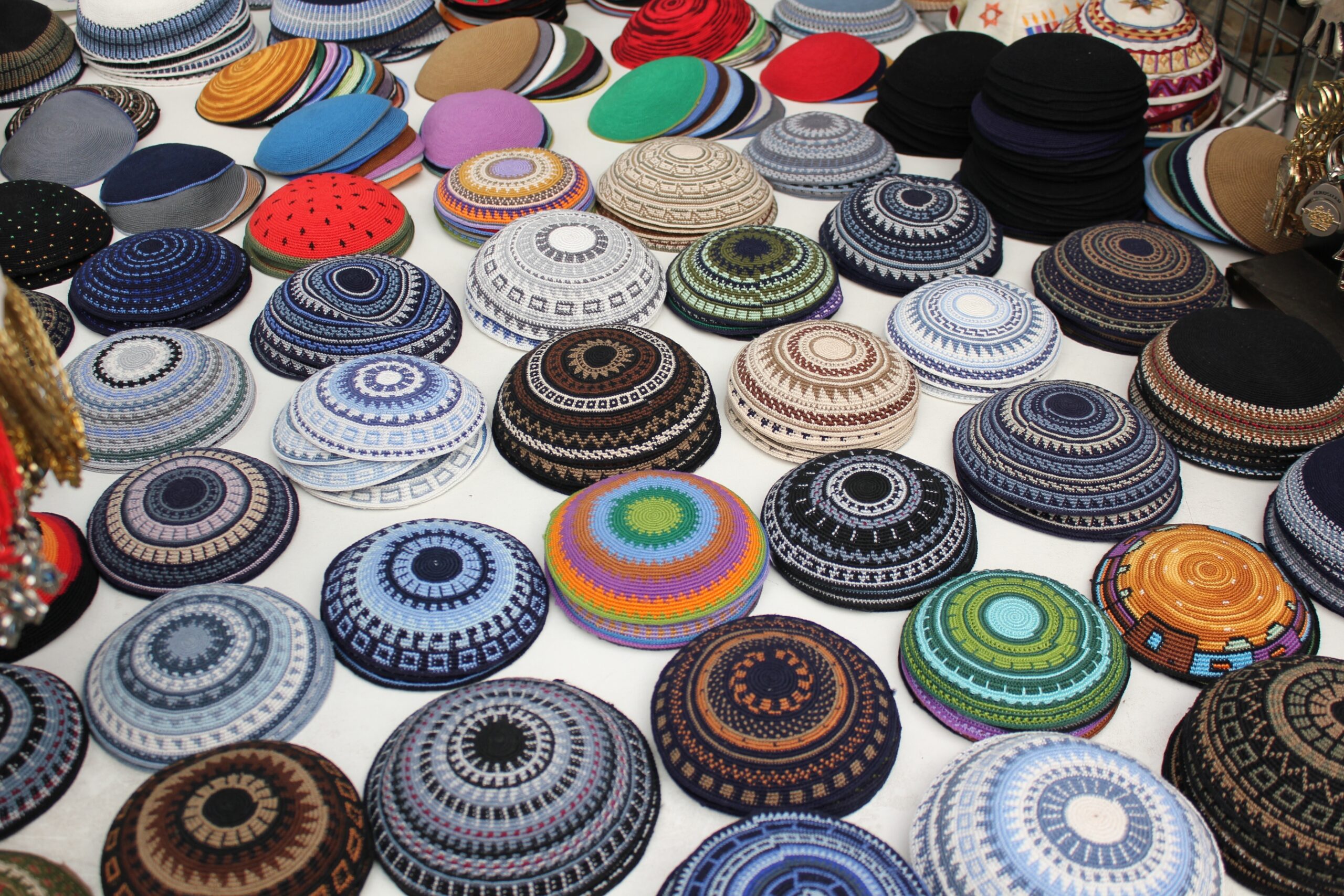 Colorful kippahs organized, for sale 