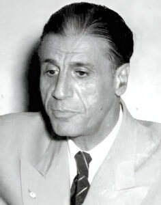 Pierre Gemayel speaking into a microphone.