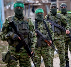 Masked Hamas militants carrying rifles during a patrol in Gaza