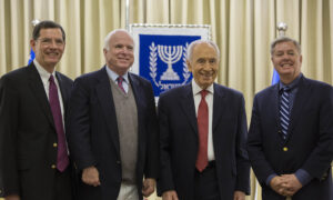 Lindsey Graham, Shimon Peres, John McCain and John Barrasso standing together in Jerusalem.