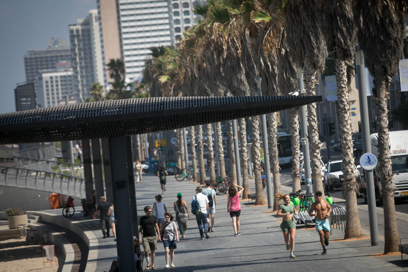 people jogging on beach tel aviv promenade