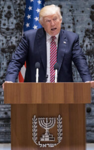 President Donald Trump speaks at a podium in Jerusalem with Israeli and American flags behind him.