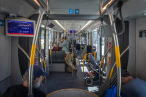 Passengers seated inside a Jerusalem light rail train on the new Green Line.