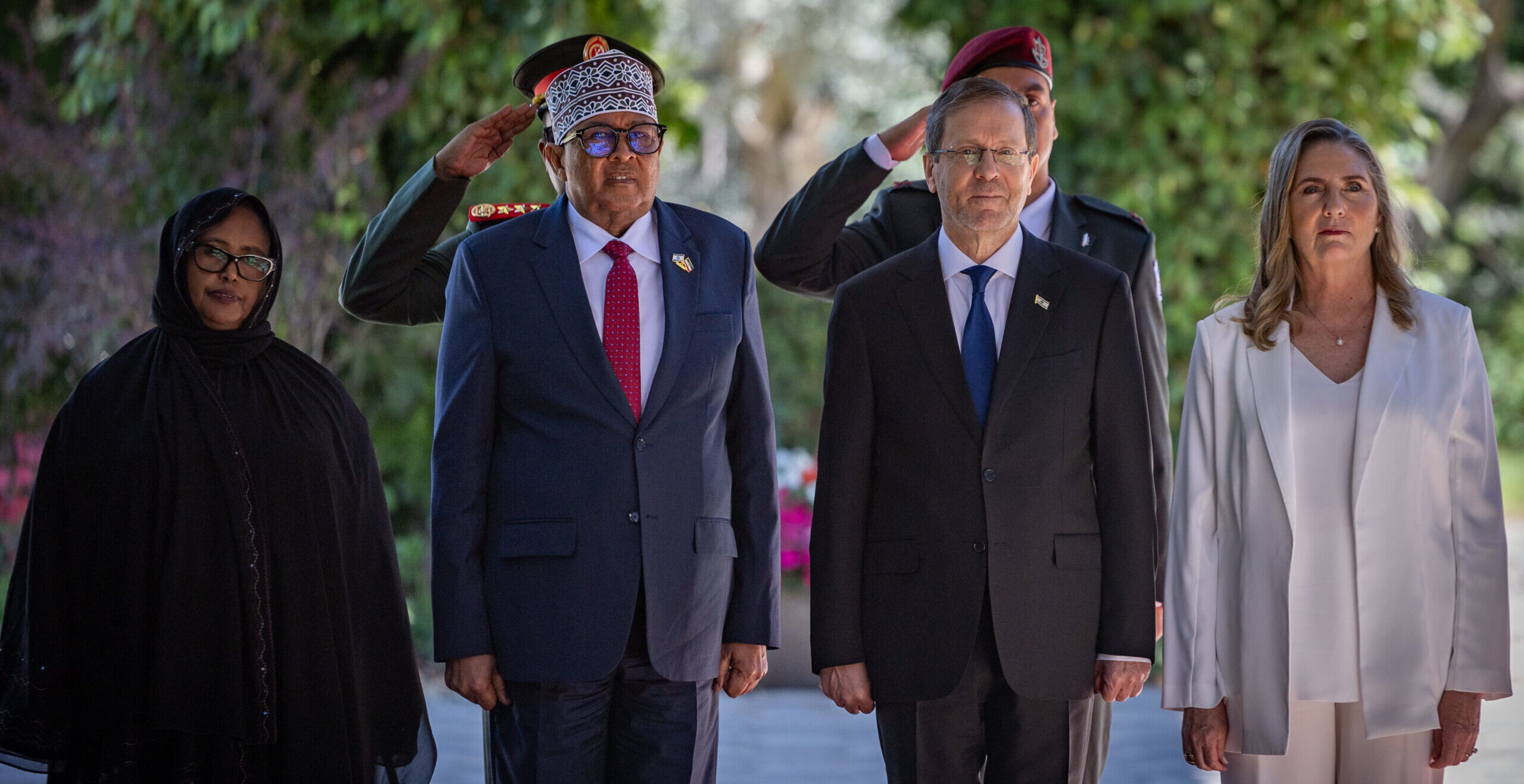 Somaliland President Abdirahman Mohamed Abdullahi Irro stands beside President Isaac Herzog during a ceremony in Jerusalem.