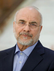 Mohammad Bagher Qalibaf wearing glasses and a dark suit.