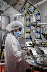 A worker at the Ben & Jerry’s factory near Kiryat Malakhi beside an ice cream production line.