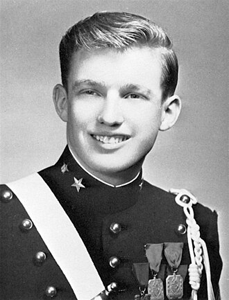 Young Donald Trump poses in a military academy uniform.