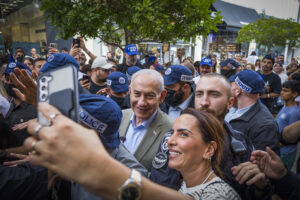 Prime Minister Benjamin Netanyahu surrounded by supporters during an election campaign event in Ashdod.