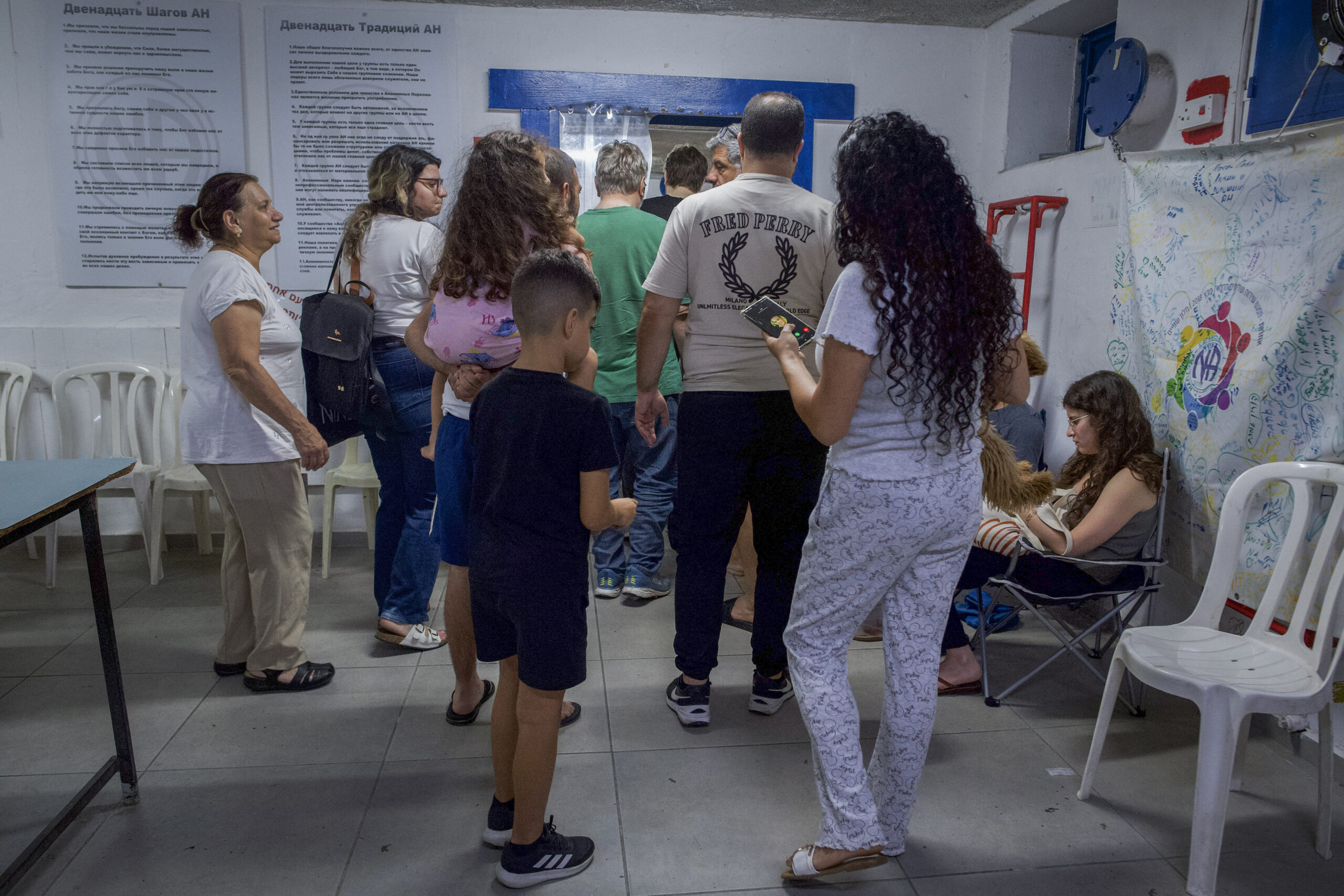 Israelis take cover in a public shelter in Haifa during a missile siren.