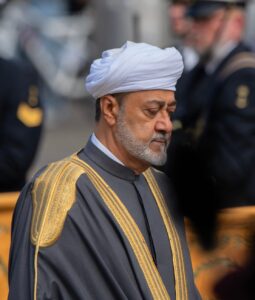 The Sultan of Oman walking during a formal ceremony.